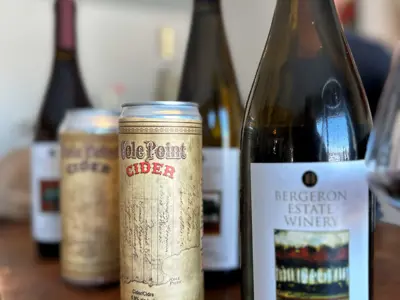 Wine bottles and cider on a table